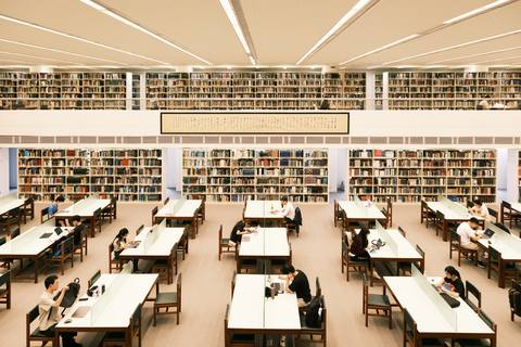 University library reading room with students studying